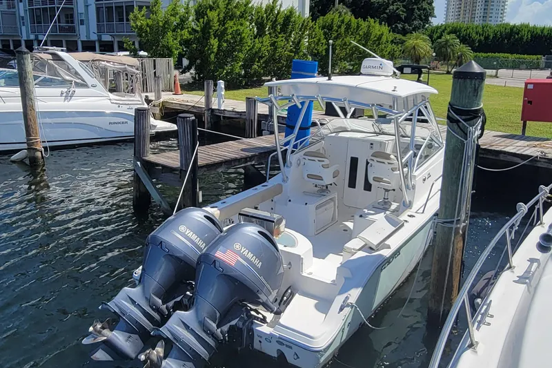 Slide: The Image of 2018 Sea Fox 256 Voyager boat docked with twin Yamaha outboard engines. - 4