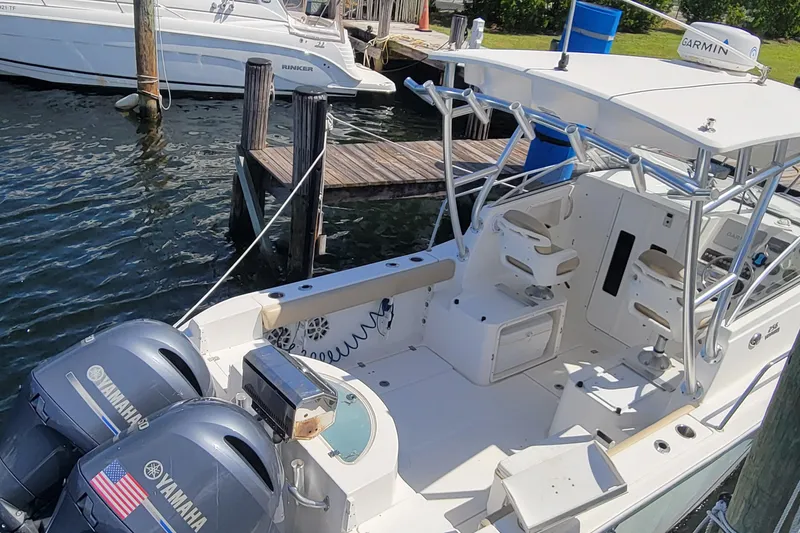 Slide: The Image of 2018 Sea Fox 256 Voyager boat docked with twin Yamaha engines. - 5