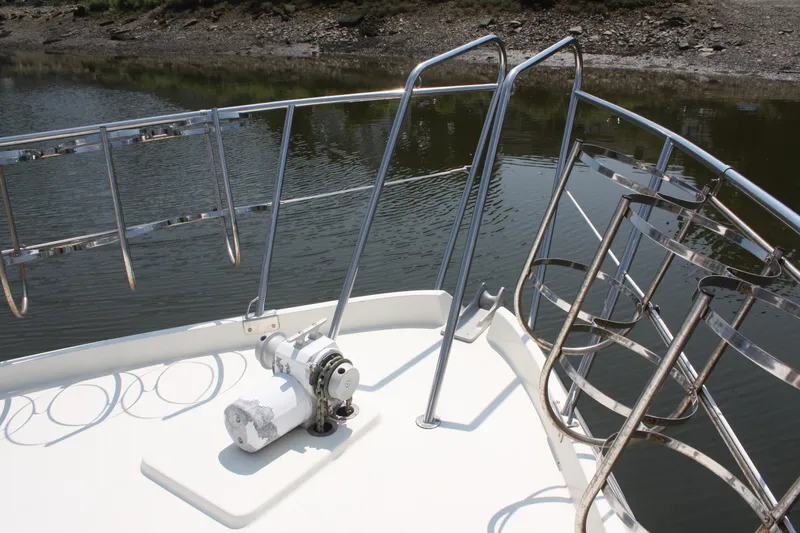 Slide: The Image of Bow of 1986 Birchwood 42 Empress yacht with chrome railings and winch. - 7
