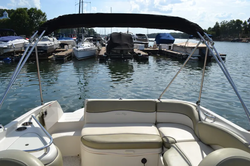Slide: The Image of 2005 Sea Ray 240 Sundeck at marina, view from rear seating area. - 12