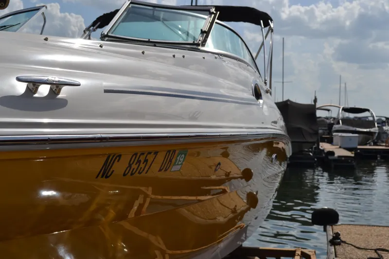 Slide: The Image of 2005 Sea Ray 240 Sundeck boat docked at marina. - 18