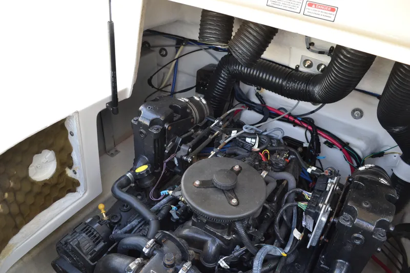 Slide: The Image of Engine compartment of a 2005 Sea Ray 240 Sundeck boat. - 21