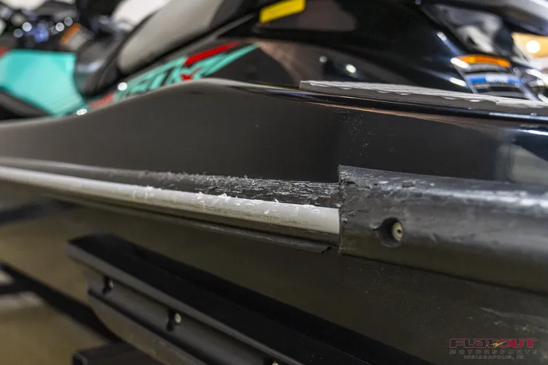 Slide: The Image of Close-up of a 2020 Kawasaki STX 160X jet ski with visible hull damage. - 15