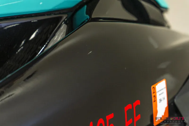 Slide: The Image of Close-up of 2020 Kawasaki STX 160X jet ski, black and teal body with registration sticker. - 20