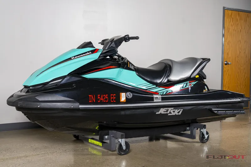 Slide: The Image of 2020 Kawasaki STX 160X jet ski in showroom. - 3