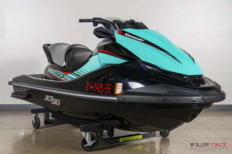 Slide: The Image of 2020 Kawasaki STX 160X jet ski in teal and black on display. - 6