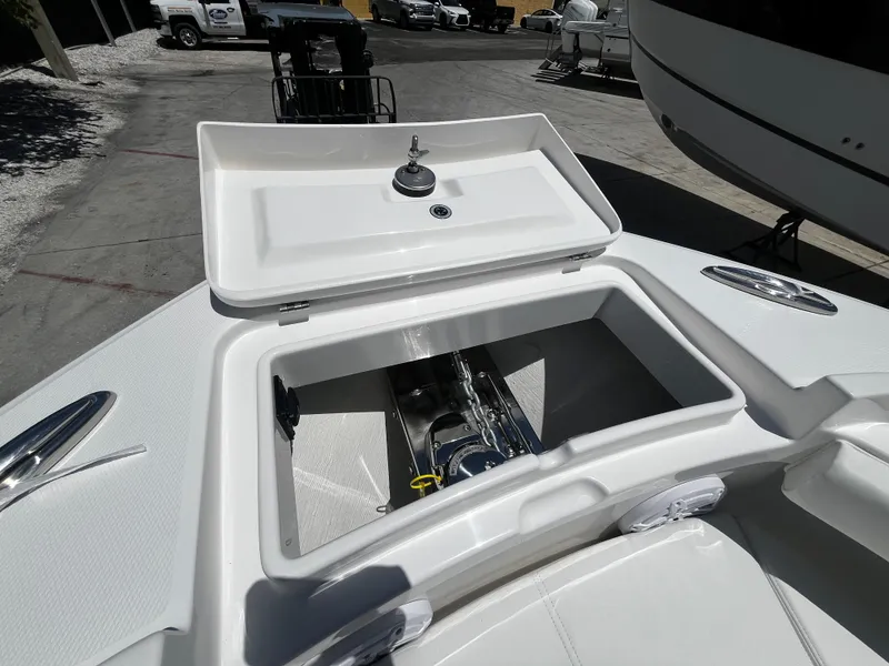 Slide: The Image of 2025 Regulator 23 boat anchor storage compartment. - 23