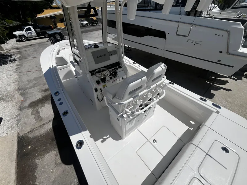 Slide: The Image of 2025 Regulator 23 boat interior with center console and seating. - 26