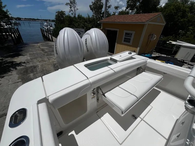 Slide: The Image of 2025 Regulator 23 boat with dual outboard engines and spacious seating area. - 9