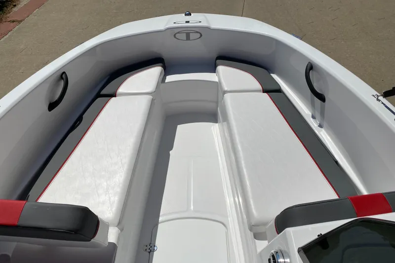 Slide: The Image of 2024 Tahoe T16 boat interior with white and red cushioned seating. - 3