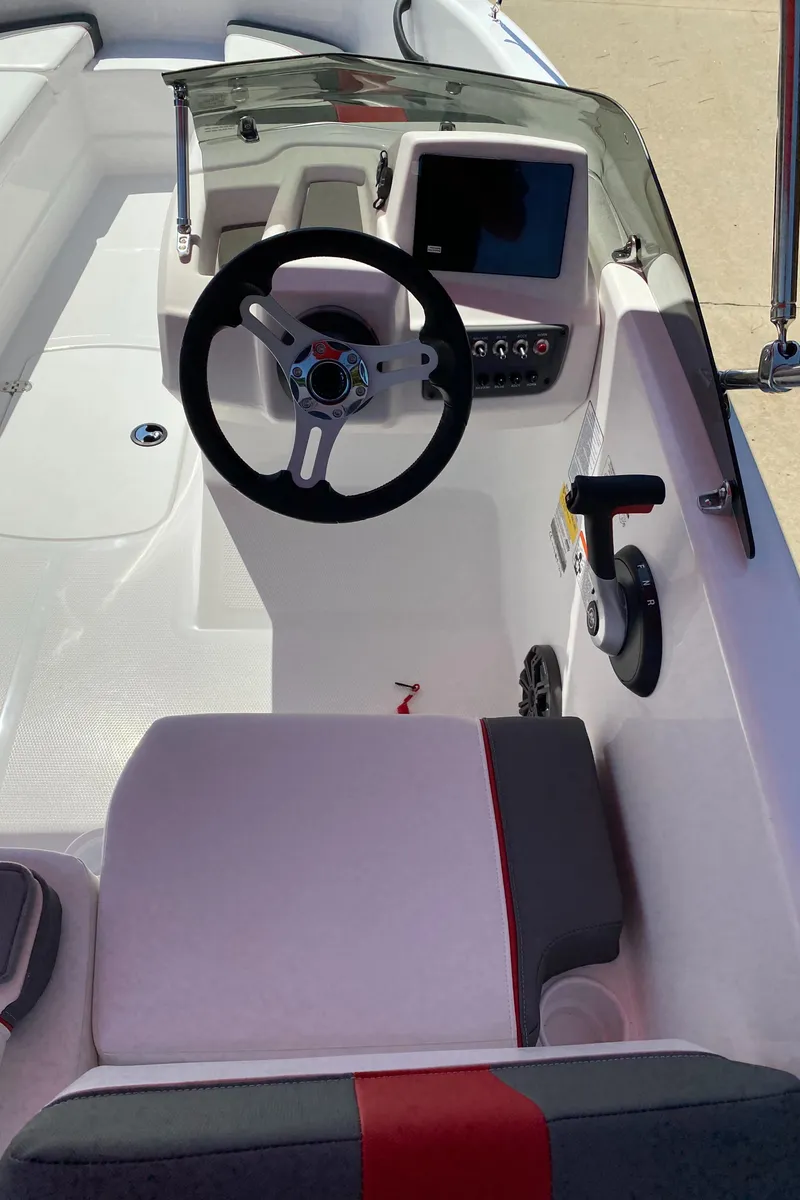 Slide: The Image of 2024 Tahoe T16 boat cockpit with steering wheel and control panel. - 5