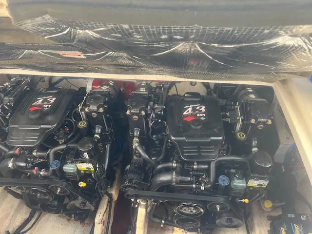 Slide: The Image of Twin engines of a 2005 Sea Ray 280 Sundancer boat. - 26