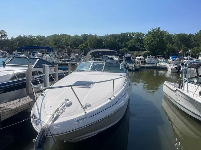 Slide: The Image of 2005 Sea Ray 280 Sundancer docked at a marina on a sunny day. - 3