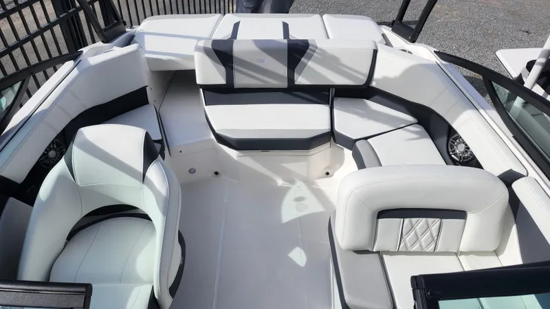 Slide: The Image of 2025 Regal 21 OBX boat interior with sleek seating and modern design. - 16