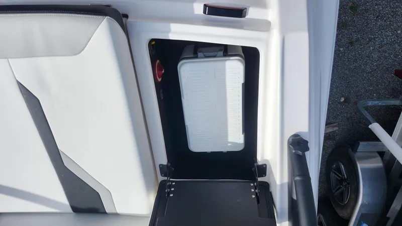 Slide: The Image of 2025 Regal 21 OBX boat dashboard with modern steering wheel and controls. - 22