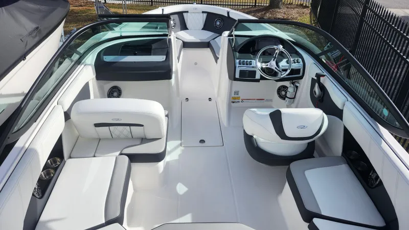 Slide: The Image of 2025 Regal 21 OBX boat interior with gray and white seating. - 25
