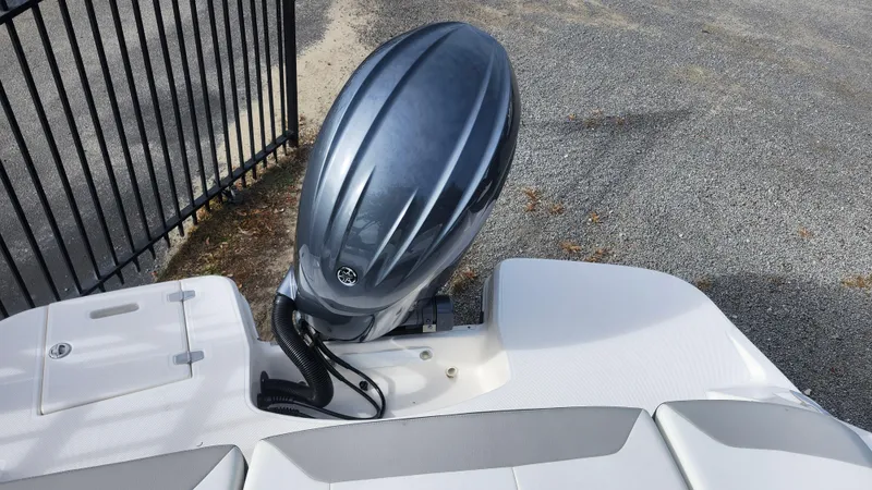 Slide: The Image of 2025 Regal 21 OBX boat with sleek outboard motor design. - 5