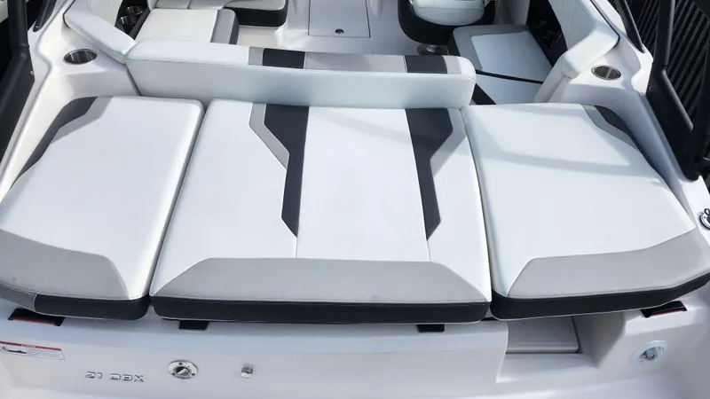 Slide: The Image of 2025 Regal 21 OBX boat interior with sleek, modern seating design. - 9