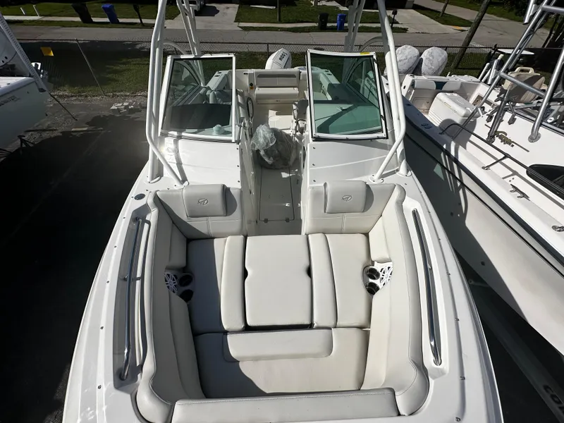 Slide: The Image of 2025 Sailfish 245 DC boat with spacious seating and dual console design. - 23