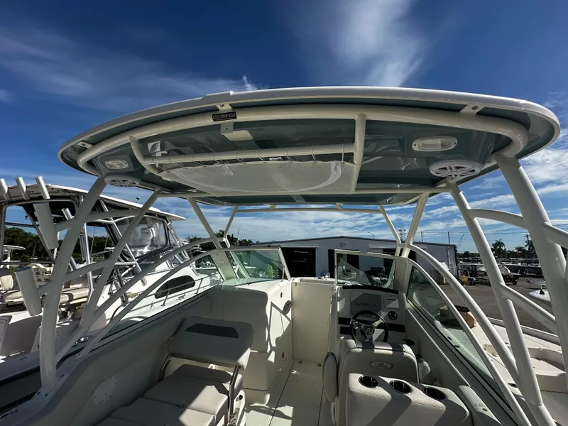 Slide: The Image of 2025 Sailfish 245 DC boat interior with hardtop and seating. - 33