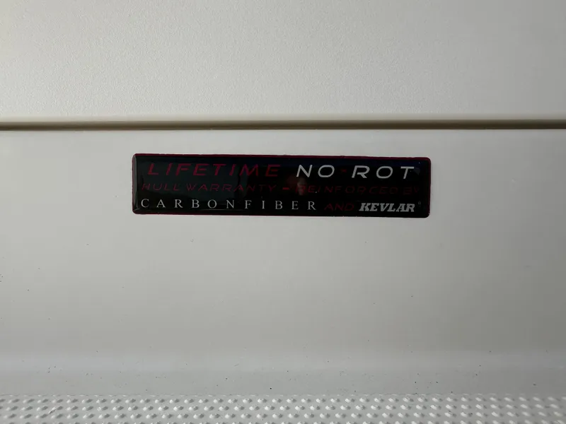 Slide: The Image of 2025 Sailfish 245 DC boat with lifetime no-rot carbon fiber and Kevlar reinforcement. - 34