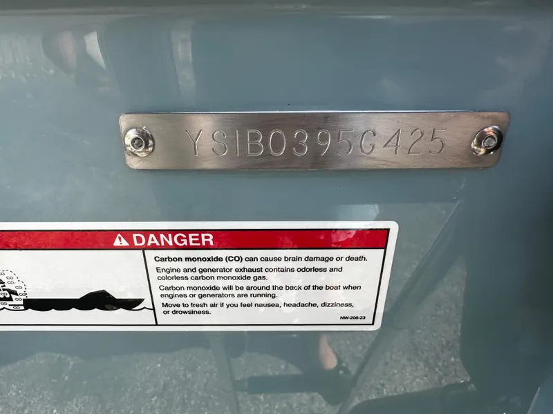 Slide: The Image of Serial number plate and warning label on a 2025 Sailfish 245 DC boat. - 36
