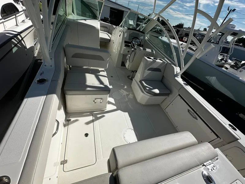 Slide: The Image of 2025 Sailfish 245 DC boat interior with seating and helm station. - 8