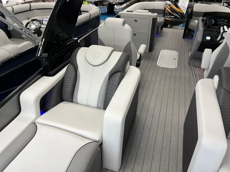Slide: The Image of 2025 Godfrey Monaco 235 RL luxury pontoon boat interior with plush seating and modern design. - 14