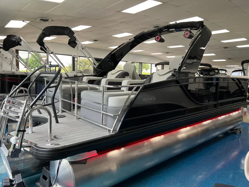 Slide: The Image of 2025 Godfrey Monaco 235 RL pontoon boat in showroom. - 2