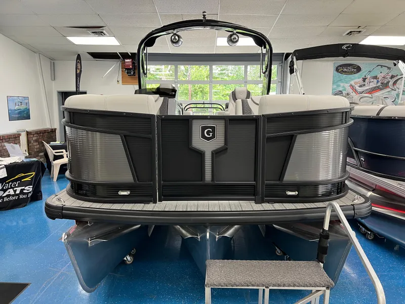 Slide: The Image of 2025 Godfrey Monaco 235 RL pontoon boat displayed indoors. - 3