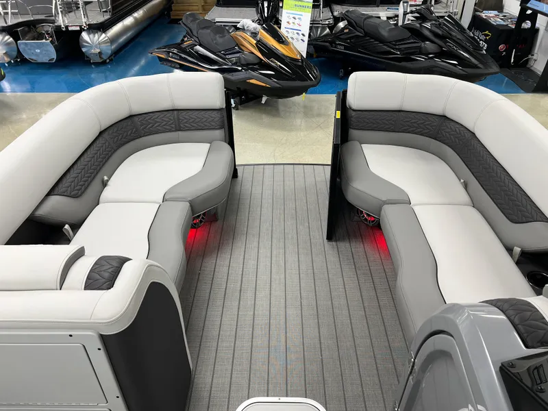 Slide: The Image of 2025 Godfrey Monaco 235 RL pontoon boat interior with luxurious seating and ambient lighting. - 30
