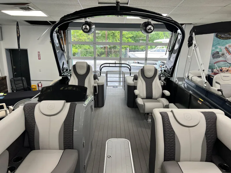 Slide: The Image of 2025 Godfrey Monaco 235 RL pontoon boat interior with luxurious seating and modern design. - 7