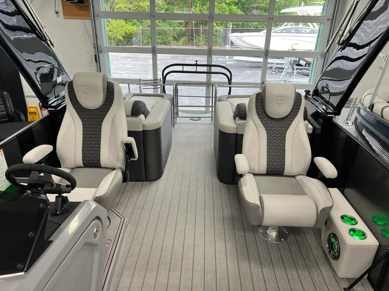 Slide: The Image of 2025 Godfrey Monaco 235 RL interior with luxurious seating and modern design. - 8
