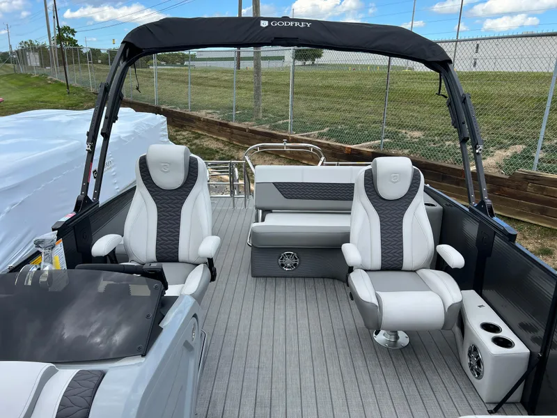 Slide: The Image of 2025 Godfrey Monaco 235 RL pontoon boat interior with luxury seating. - 10