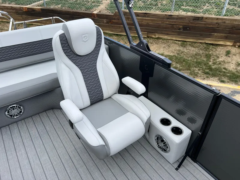 Slide: The Image of 2025 Godfrey Monaco 235 RL boat interior with luxury seating and cup holders. - 11