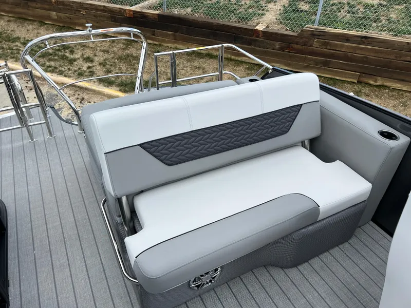 Slide: The Image of 2025 Godfrey Monaco 235 RL boat with gray and white seating. - 13