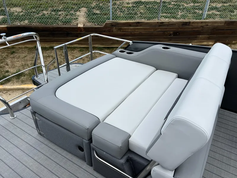 Slide: The Image of 2025 Godfrey Monaco 235 RL boat with luxurious seating and modern design. - 15