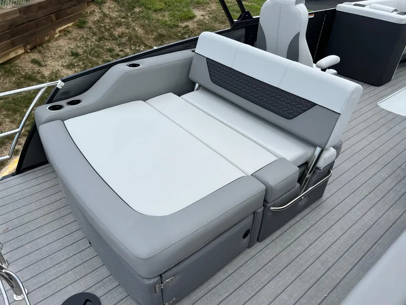 Slide: The Image of 2025 Godfrey Monaco 235 RL boat with luxurious seating and modern design. - 17