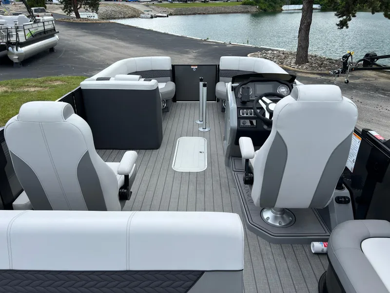 Slide: The Image of 2025 Godfrey Monaco 235 RL pontoon boat interior with modern seating and steering console. - 18