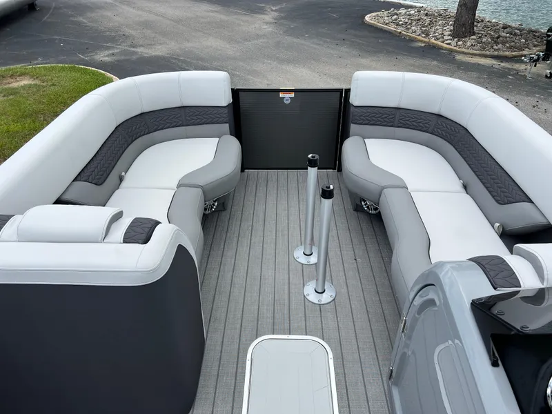 Slide: The Image of 2025 Godfrey Monaco 235 RL pontoon boat with spacious seating and modern design. - 24
