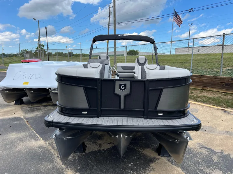 Slide: The Image of 2025 Godfrey Monaco 235 RL pontoon boat on display outdoors. - 5