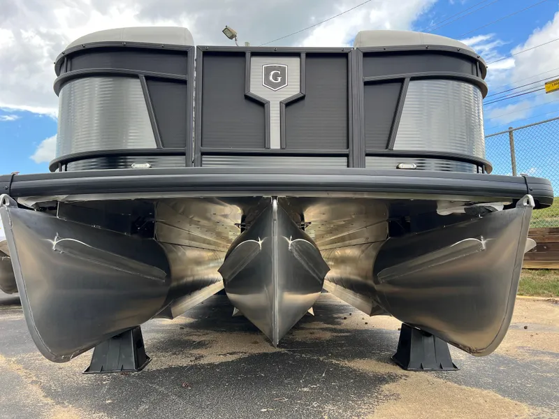 Slide: The Image of 2025 Godfrey Monaco 235 RL pontoon boat front view, showcasing sleek design and sturdy pontoons. - 6