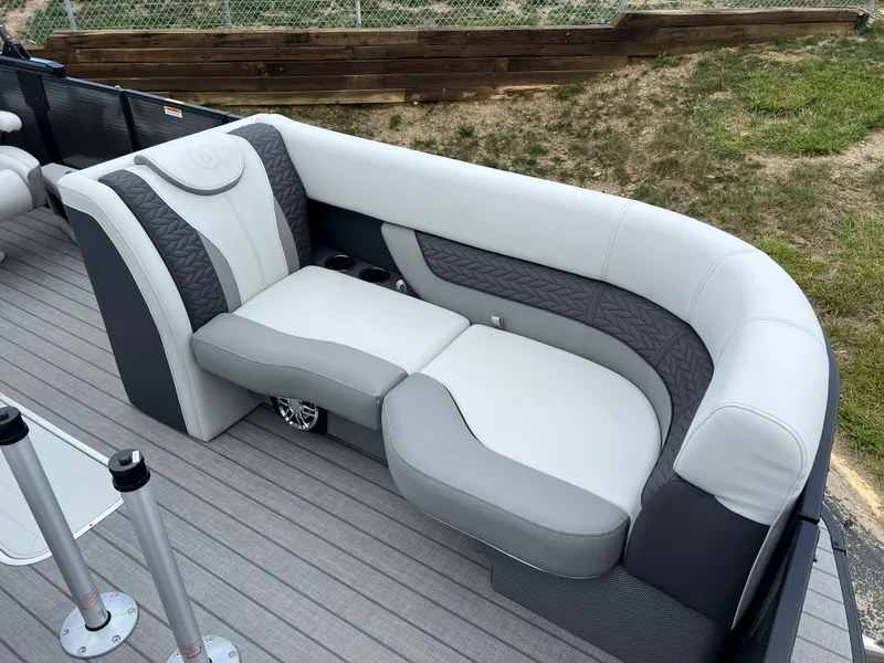 Slide: The Image of 2025 Godfrey Monaco 235 RL boat with luxurious seating and modern design. - 9