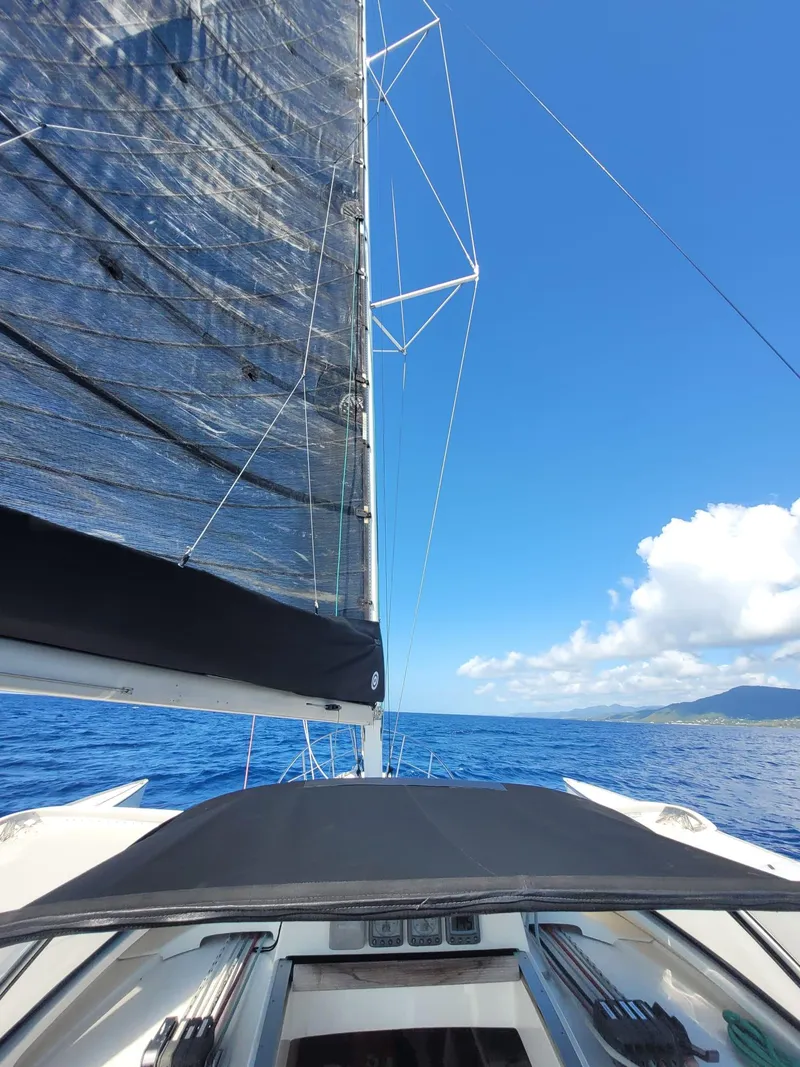 Slide: The Image of Sailing on a 2007 Dragonfly 35 Ultimate trimaran under clear blue skies. - 6