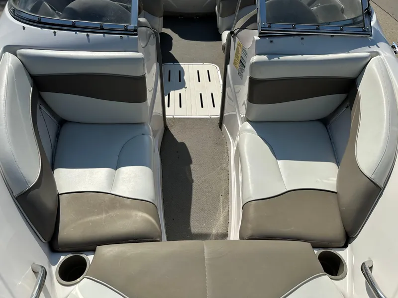 Slide: The Image of 2001 Tahoe Q5 boat interior with gray and white seating. - 3