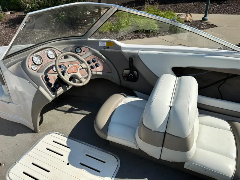Slide: The Image of Interior of a 2001 Tahoe Q5 boat with steering wheel and dashboard controls. - 6