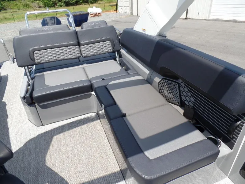 Slide: The Image of 2025 Harris Crowne 250 boat interior with gray seating and modern design. - 13