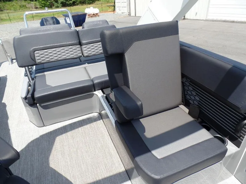 Slide: The Image of 2025 Harris Crowne 250 boat interior with modern gray seating and textured upholstery. - 14
