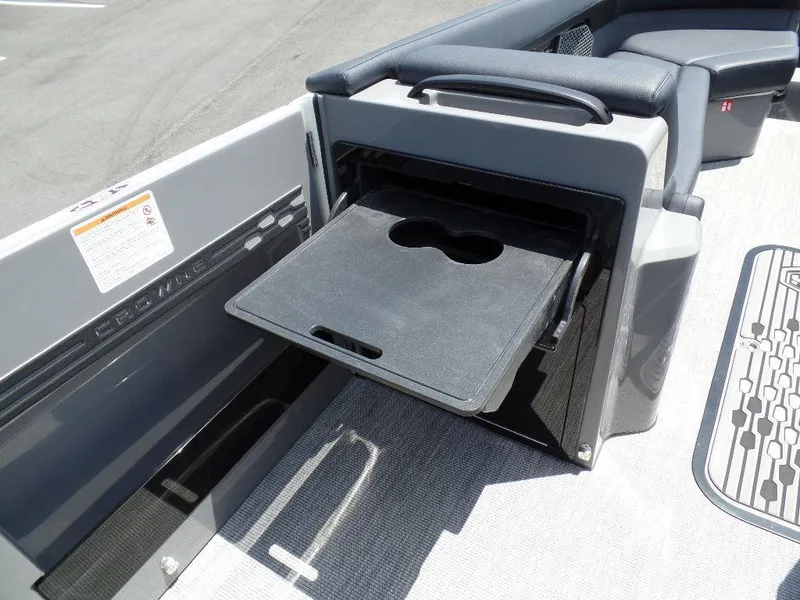 Slide: The Image of 2025 Harris Crowne 250 boat with a built-in cup holder tray. - 16