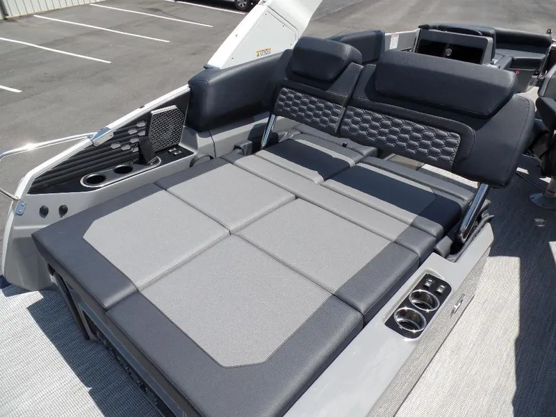 Slide: The Image of 2025 Harris Crowne 250 boat interior with luxurious seating and cup holders. - 21